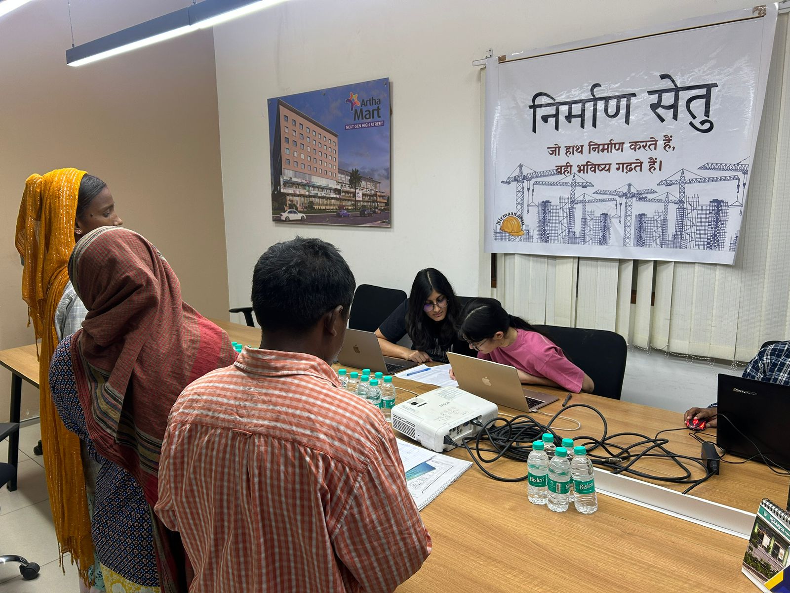 Workers lining up at NirmaanSetu outdoor registration camp