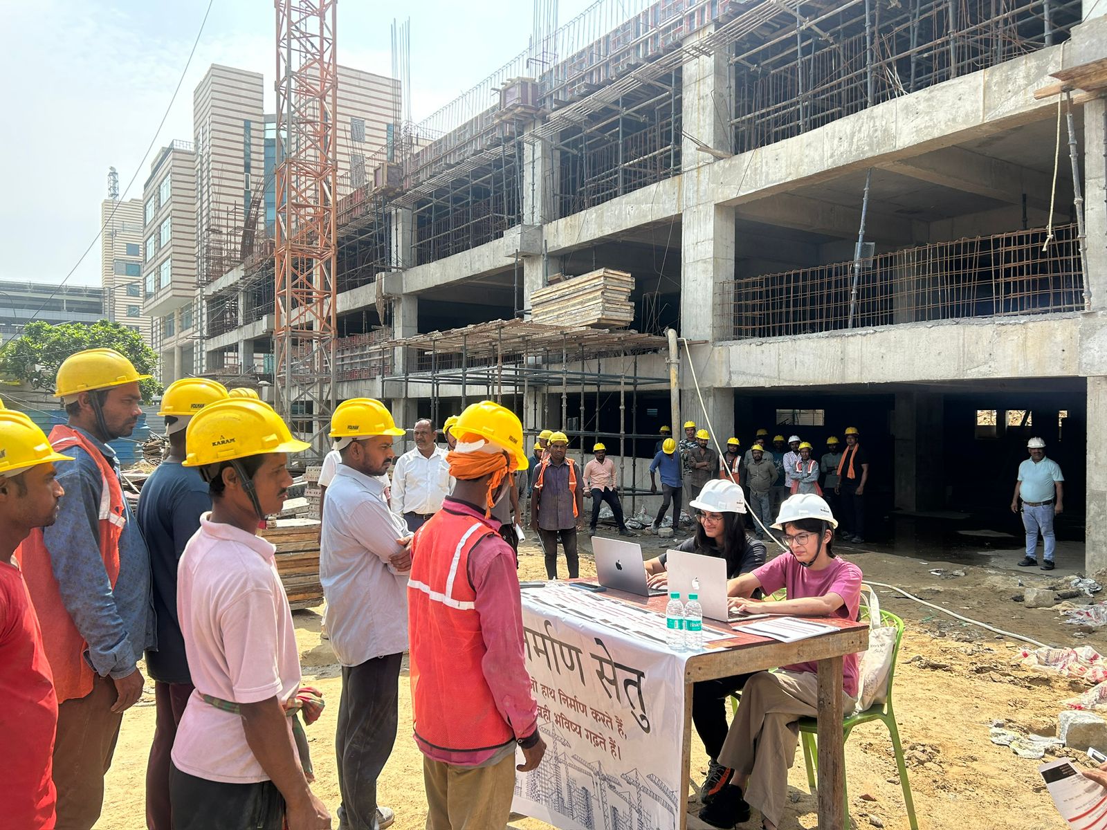 NirmaanSetu volunteers distributing leaflets at construction site